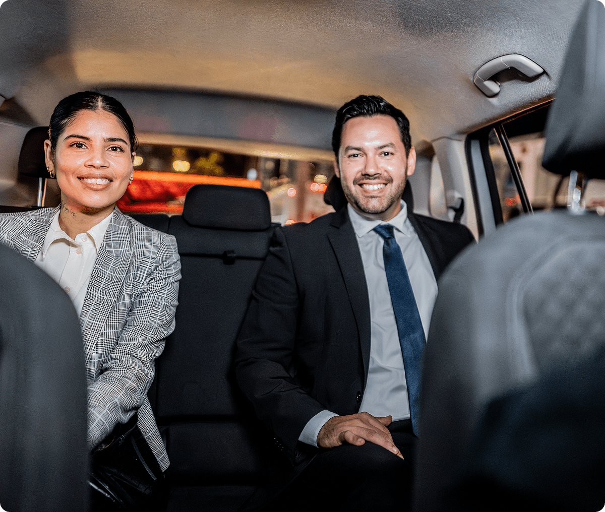 Smiling colleagues in vehicle